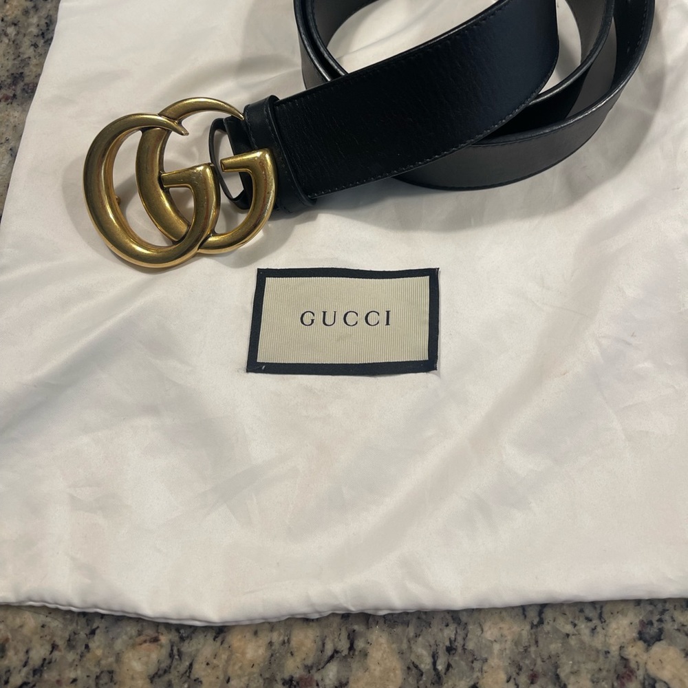 Gucci black leather belt, gold buckle, excellent condition, with dust bag